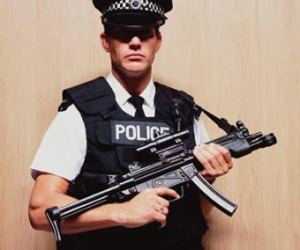 PoliceOfficerHoldingMachineGun