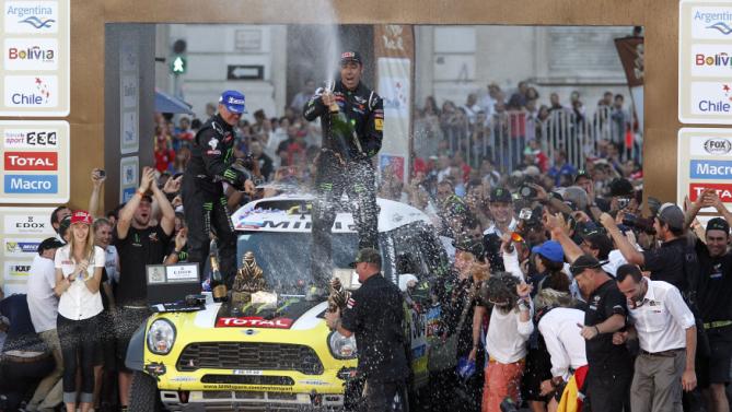 Nani Roma of Spain and co-pilot celebrate winning the car title of the South American edition of the Dakar Rally 2014 in Valparaiso