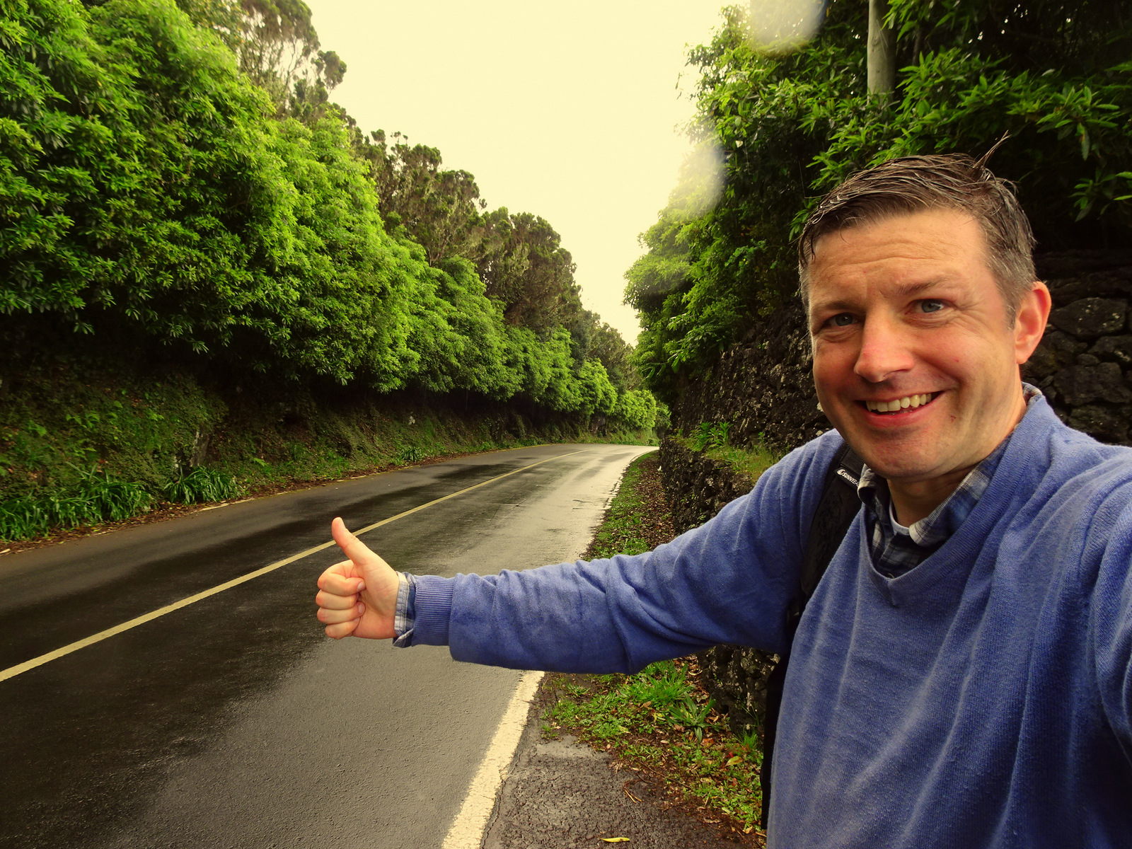 Andreas Moser hitchhiking in the rain